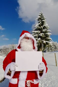 Santa Claus, Father Christmas holding blank sign