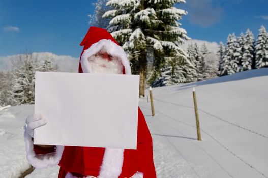 Santa Claus, Father Christmas holding blank sign