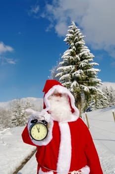 Santa Claus, Father Christmas holds watch clock