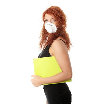 Young caucasian student woman with mask on her face. She is defending her self from viruses. Isolated on white