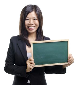 Happy smiling Asian business girl holding blank blackboard, closeup portrait on white background.