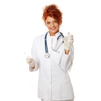 Portrait of a nurse making a drip, isolated on white