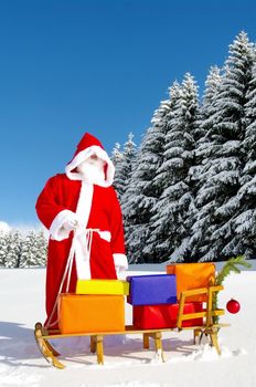 Santa Claus, Father Christmas with colorful presents on a sledge