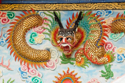chinese dragon at the wall of temple, Thailand