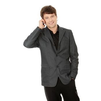 A handsome happy business man using mobile phone, isolated on white