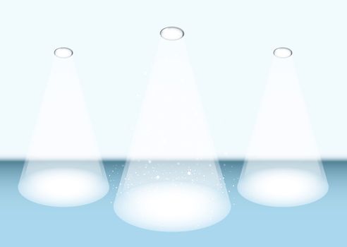 Three bright white spot lights on a blue stage for concert