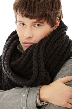 Portrait of handsome man in scarf and coat. Isolated on white background