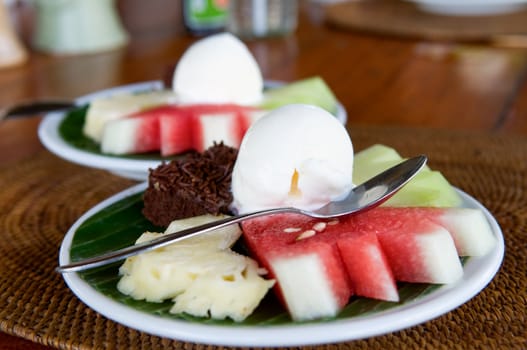 Dish of fruit and ice cream, desert