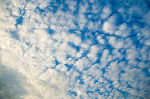 The blue and cloudy sky background