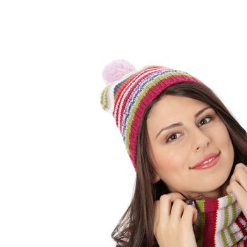 Close up of young woman with winter cap smiling at the camera isoalted on white background
