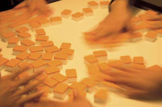 People playing mahjong on a table