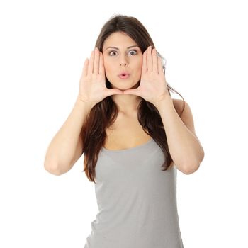 Young attractive woman framing her face with hands, over white