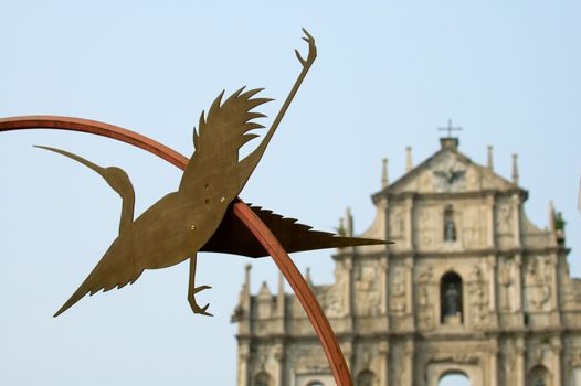 Statue of egret and Ruins of St Paul's Cathedral, Macau
