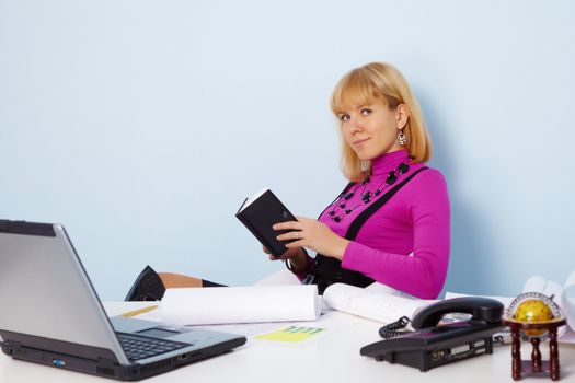 The young attractive secretary works at office