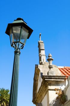 The antique lantern (street lamp) and  residential house