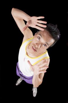 closeup of a young asian man on a black background