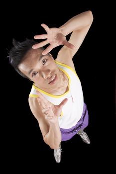 closeup of a young asian man on a black background