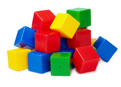 Pile of colored toy blocks isolated on white background