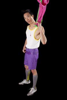 closeup of a young asian man on a black background with towel around neck