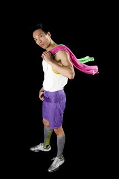 closeup of a young asian man on a black background with towel around neck