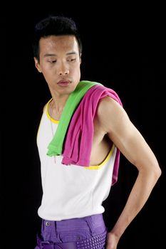 closeup of a young asian man on a black background with towel around neck