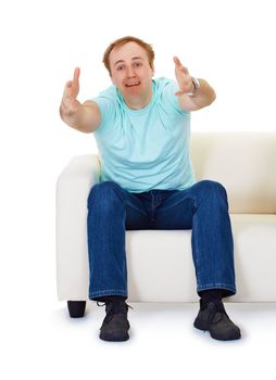 A man sits at home on the couch in despair isolated on white