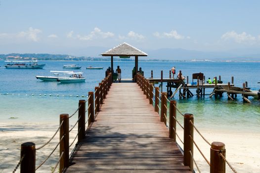 Wooden pier on tropical beach