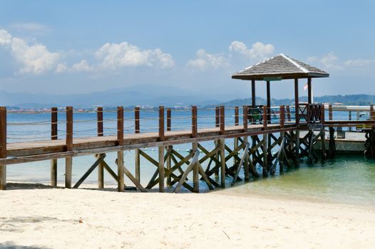 Wooden pier on tropical beach