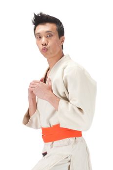 Young asian man in an Aikido, judo, Karate outfit isolated on a white background