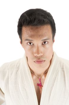 Young asian man in an Aikido, judo, Karate outfit isolated on a white background