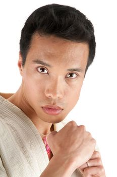 Young asian man in an Aikido, judo, Karate outfit isolated on a white background