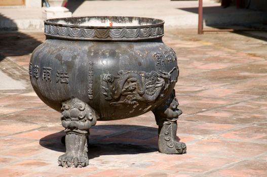 An old incense holder in a Chinese temple