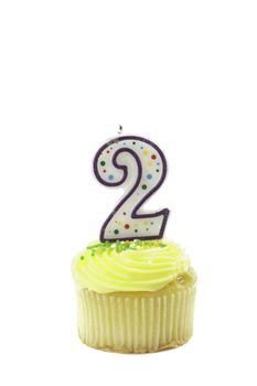 cupcake, isolated on white with a decorative candle in the shape of a number two