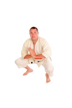 young man doing martial art exercises isolated on a white background