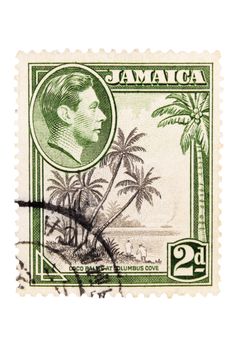 Canada - Circa 1948 : A vintage Jamaican postage stamp image of coco palms at columbus cove with inset of King George, value of 2 pence, series circa 1948