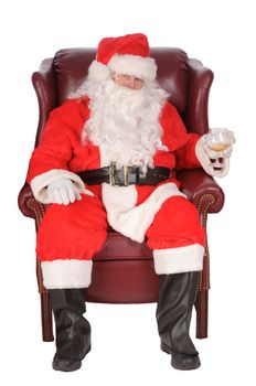 Santa enjoying a rest after a nights work, with a small libation