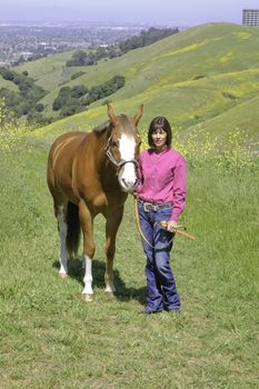 Closeup of attractive woman with her horse