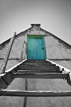 Black and white image with green door in color - very shallow depth of field