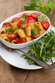 Freshly made pasta dish with tomatoes and basil