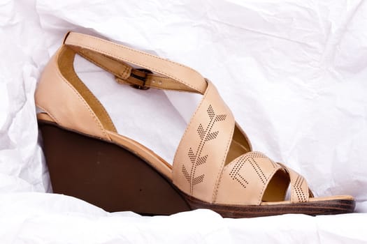 fashion series: brown fashioned sandals over white