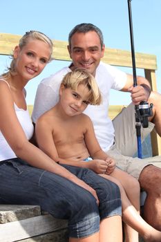 portrait of a family fishing