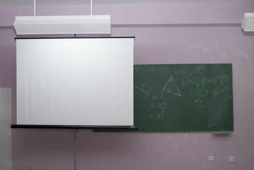 Classroom interior,with  panel and  projection screen.