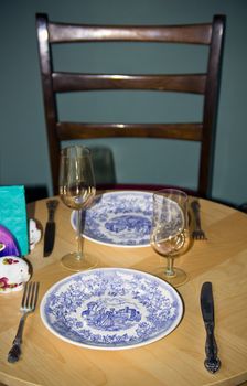 seating cutlery on the round table to supper two together
