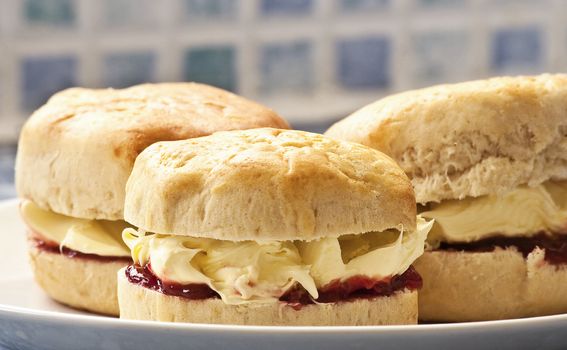 Clotted cream and jam scones on a plate