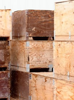 Different colors and textures of potato crates waiting for harvested potatoes