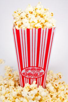 Picture of a popcorn holder with popcorn in front