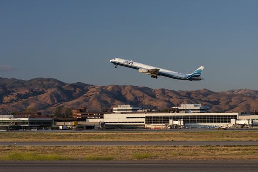 Large jet takes off from Mineta San Jose International Airport (SJC), San Jose, California, USA.  SJC is the commercial airport for the Silicon Valley.