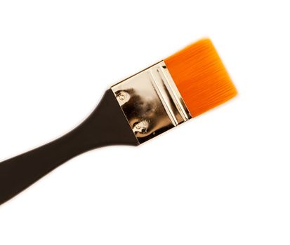 Paint brush with big soft tip and wood handle.