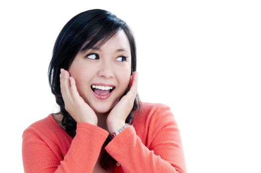 Portrait of an attractive young woman looking surprised over white background.