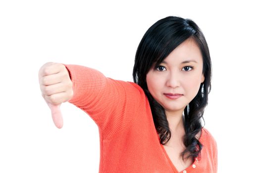 Portrait of a beautiful woman showing thumb down sign over white background.